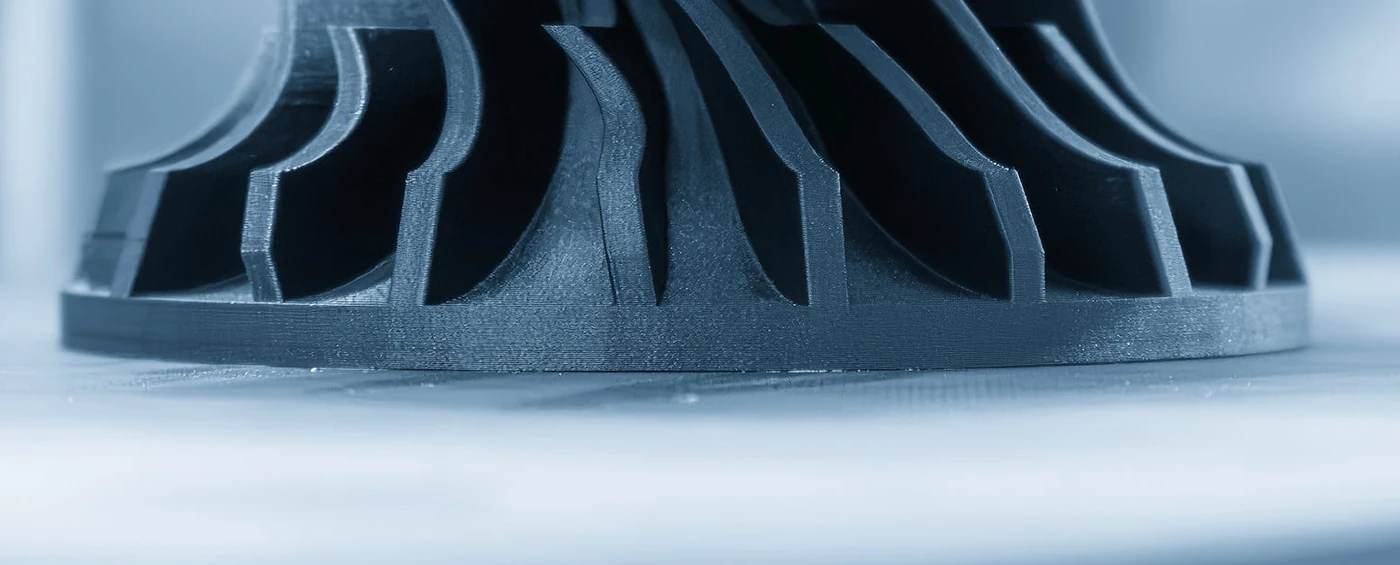 Close-up of a functional part 3D-printed in 3DXTech 3DXFLEX TPU 95A showing clean layers and finned geometry