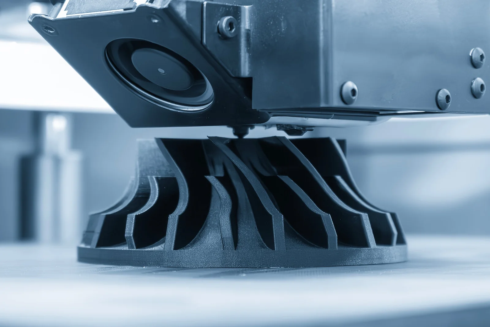 Functional part being 3D printed in glass-fiber nylon on an industrial FDM printer