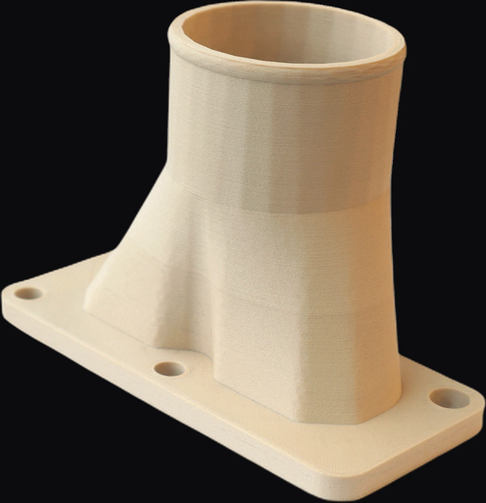 A functional flanged manifold 3D-printed in 3DXTech FibreX PEI+GF30, showing clean layers