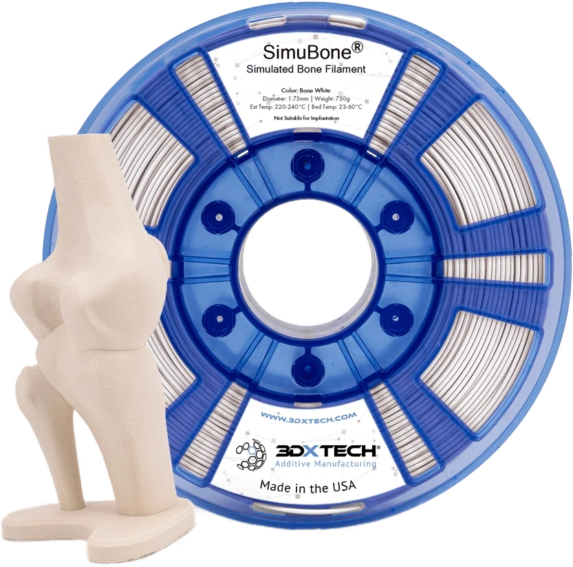 Knee-joint anatomical model 3D-printed in 3DXTech SimuBone beside the filament spool