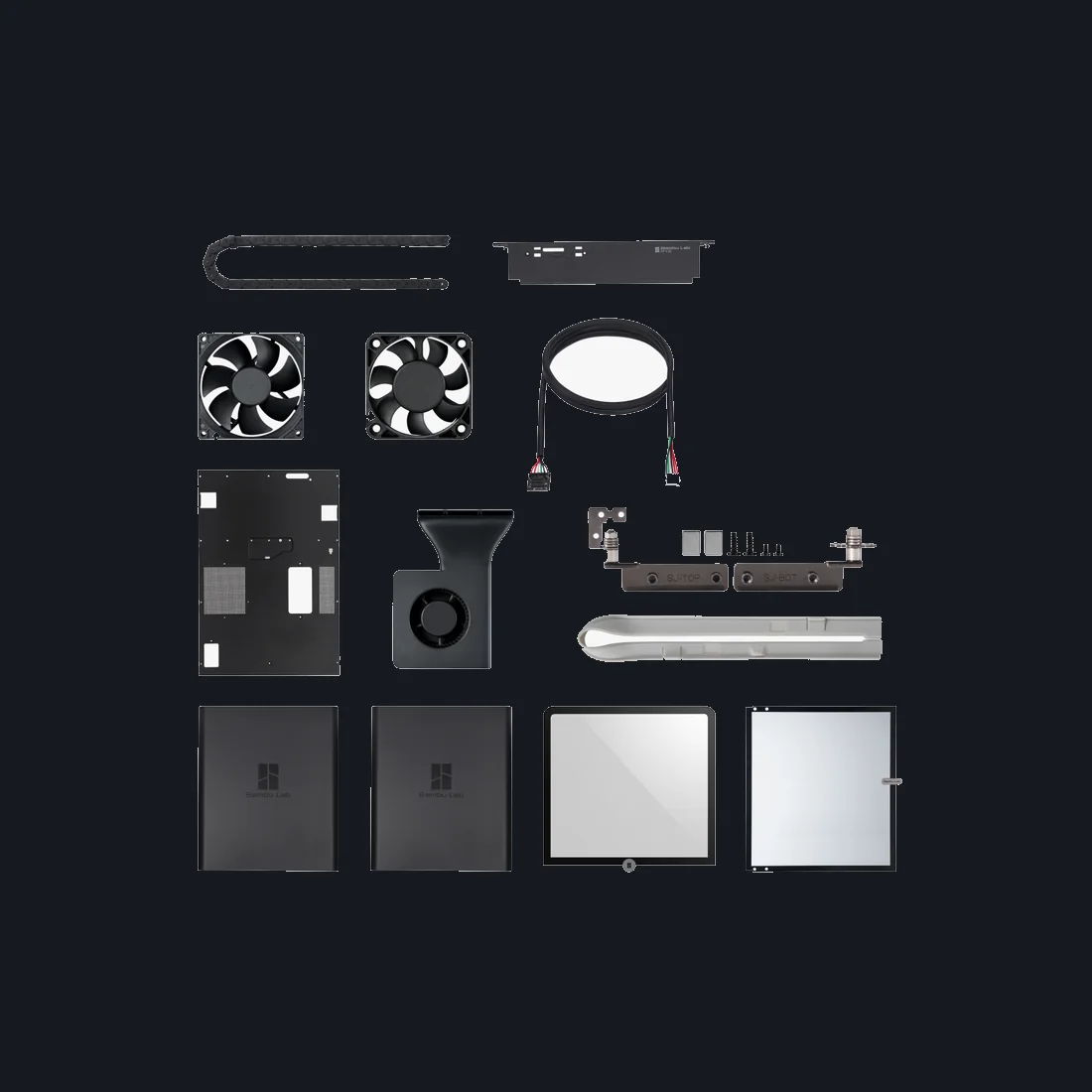 Bambu P1P Enclosure Kit contents laid out — glass, panels, fans, cable chain and PTFE