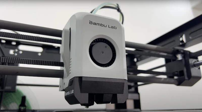 Bambu Lab P1P toolhead and all-metal hotend with direct-drive extruder, mounted on the CoreXY gantry