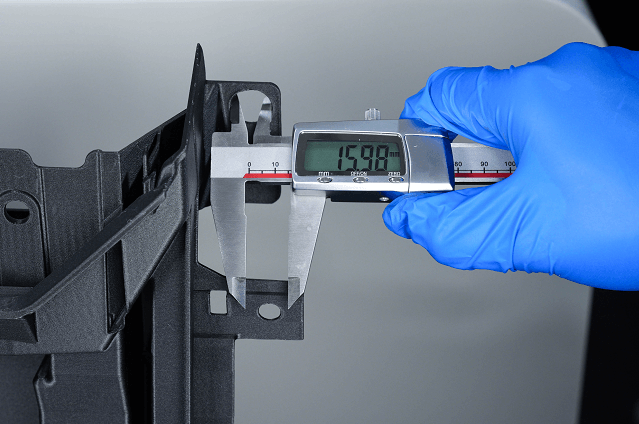 Digital caliper measuring a printed part from the CreatBot D1200 Ultra for dimensional accuracy