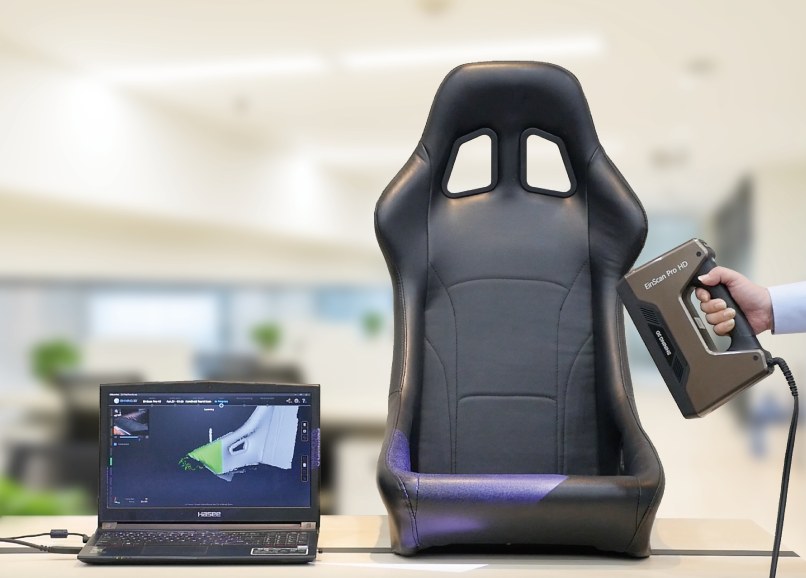 EinScan Pro HD scanning a racing bucket seat with the EXScan result shown on a laptop &mdash; automotive aftermarket