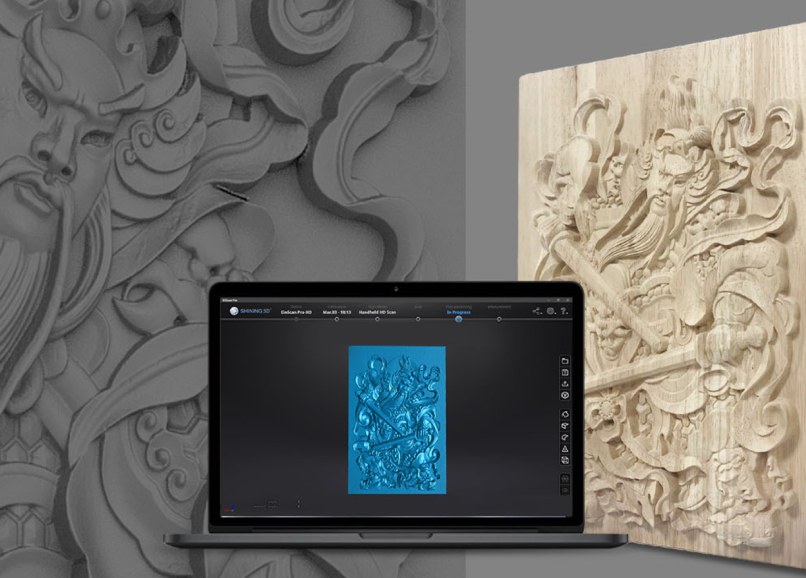 Carved relief panel beside a laptop showing the EinScan Pro HD EXScan mesh result