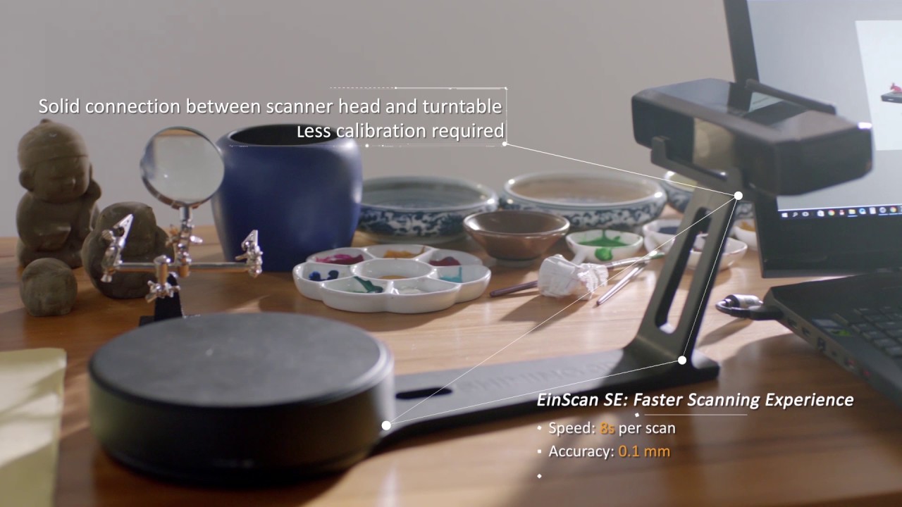 SHINING 3D EinScan SE V2 desktop demo: scan head and Auto-Scan turntable on a workbench, faster-scanning experience