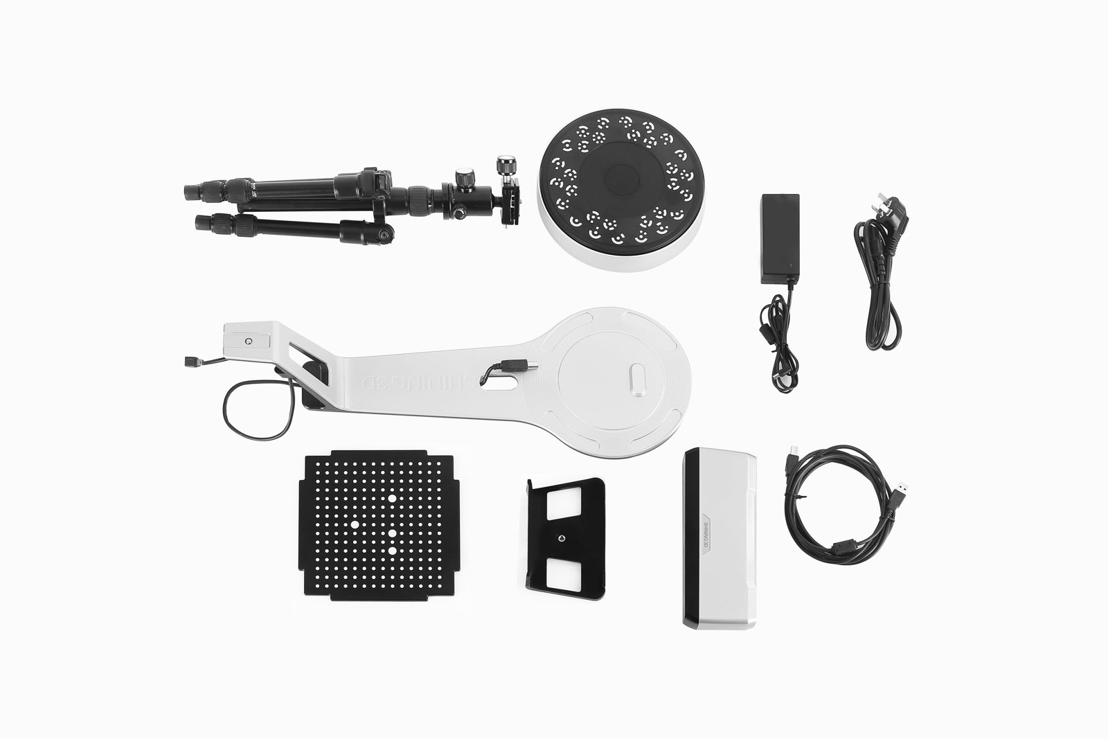 EinScan SP V2 kit flat-lay: scan head and S-arm, Auto-Scan turntable, photo tripod, calibration board, marker plate, power adapter, and USB cables
