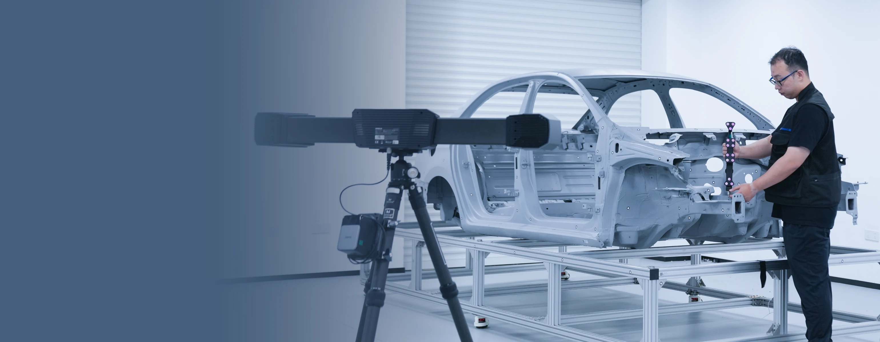 SHINING 3D FreeProbe probing a recessed feature on an automotive body-in-white with a FreeScan Trak tracker