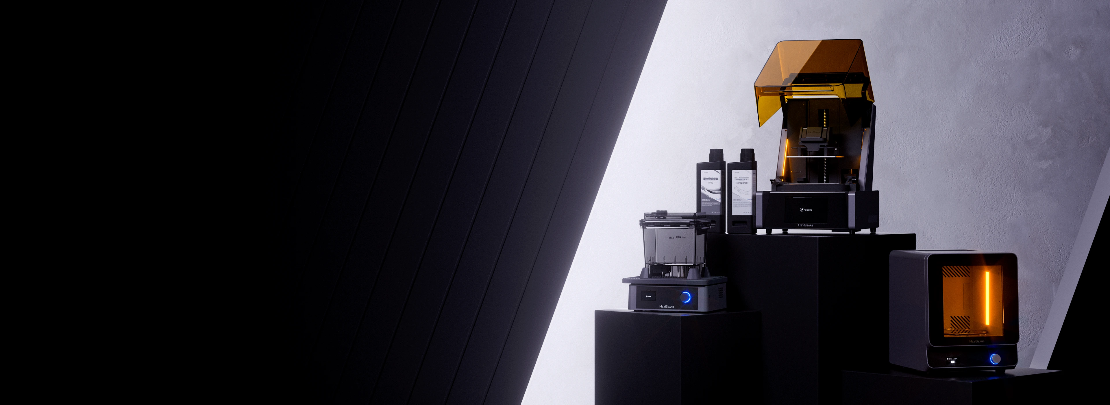 HeyGears UltraCraft Reflex resin printer shown with detailed printed parts in a studio setting