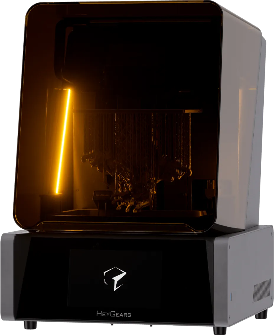 HeyGears UltraCraft Reflex resin printer with amber UV lid and a printed model on the build platform