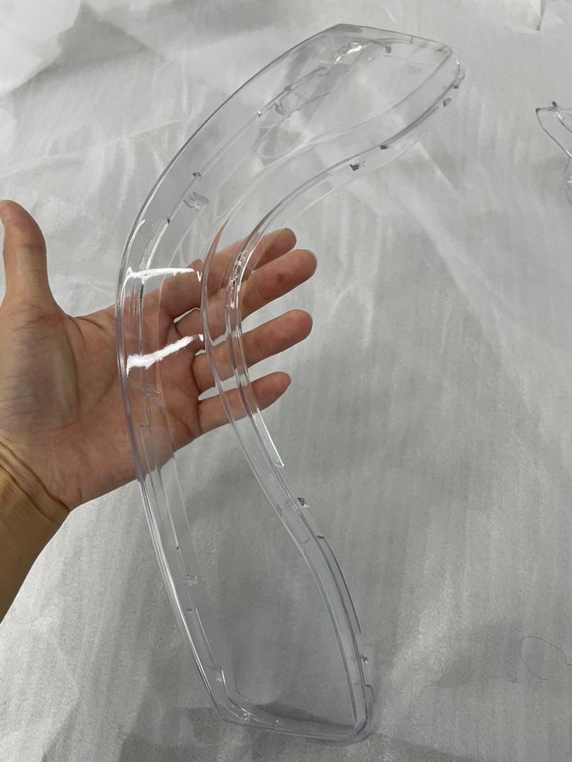Clear SLA headlight lens cover prototype held in hand &mdash; Kings SLA 1450 Pro optical output