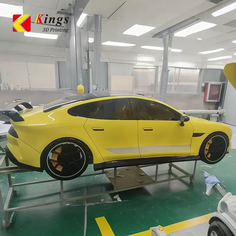 Full-scale yellow car body prototype printed on a Kings industrial SLA system