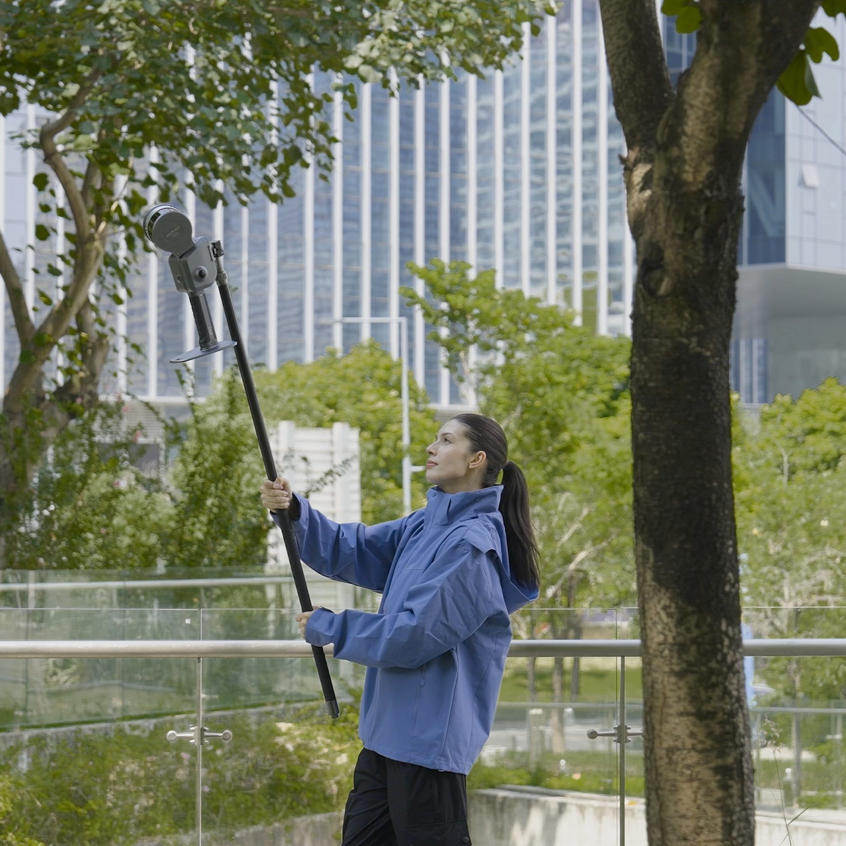 Lixel L2 Pro on extension pole — operator deploying elevated scan in field