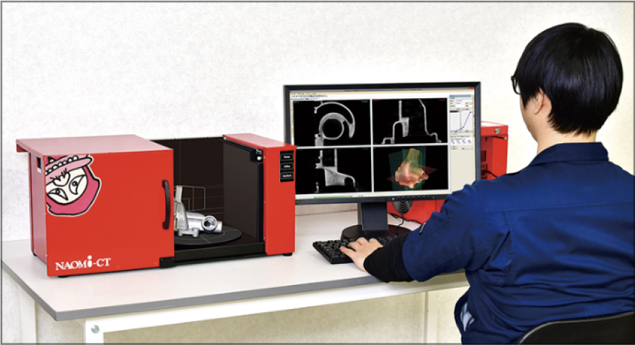 NAOMi-CT 3D-M chamber open with sample on rotation stage and operator at workstation