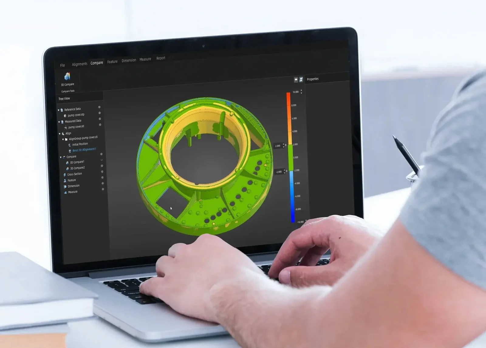SHINING3D software showing a 3D color-deviation comparison of a pump cover on a laptop